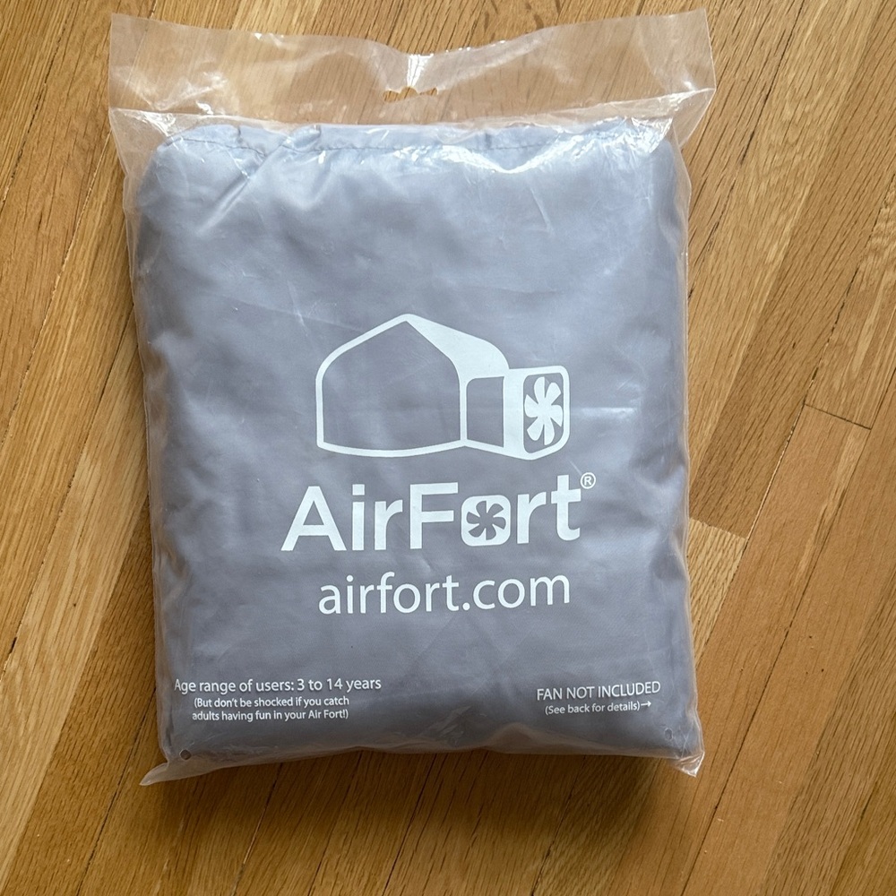 Never opened. AirFort Inflatable Play Tent